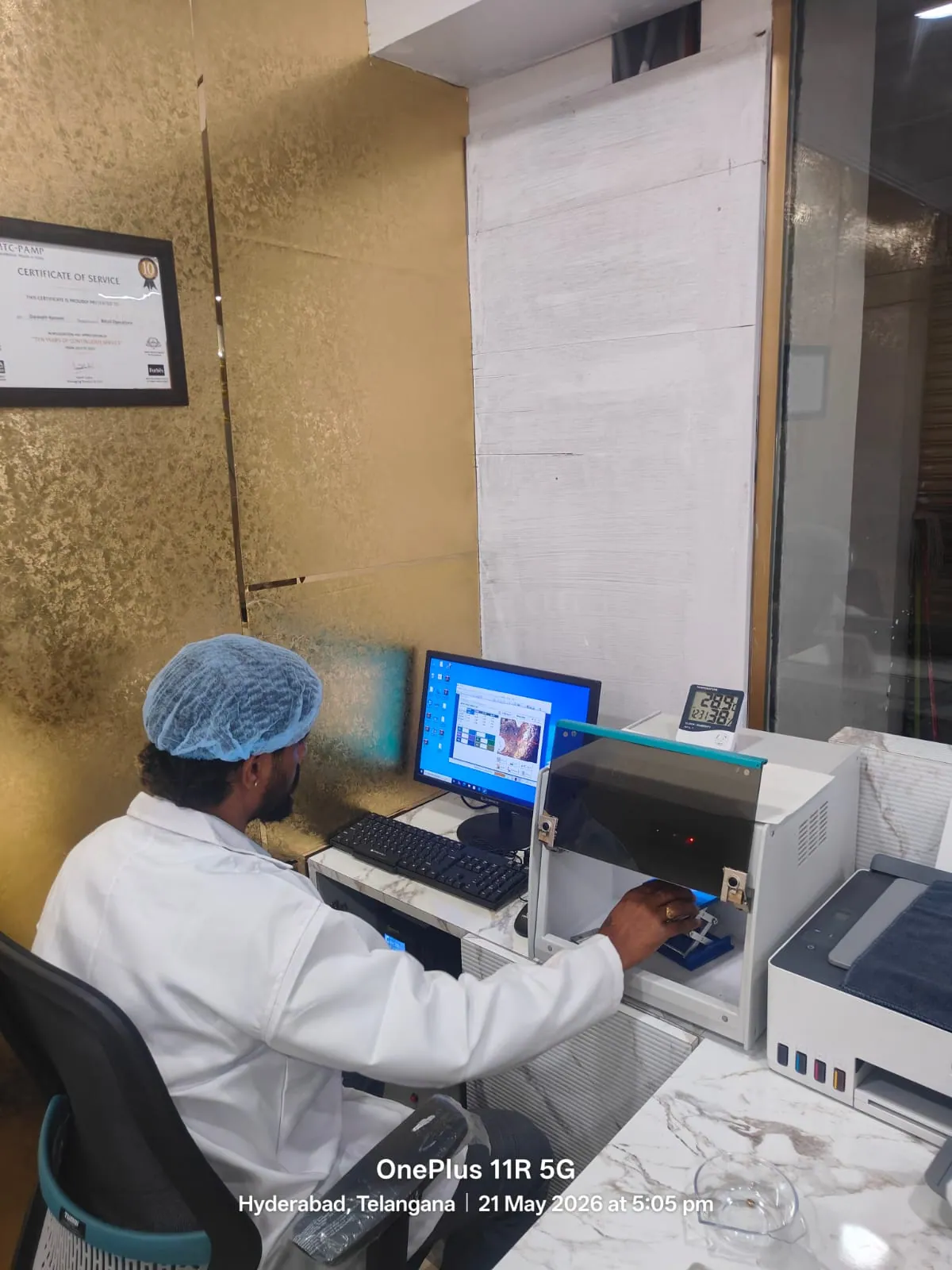 XRF karat testing machine operator at Rithika Gold Hyderabad performing gold valuation